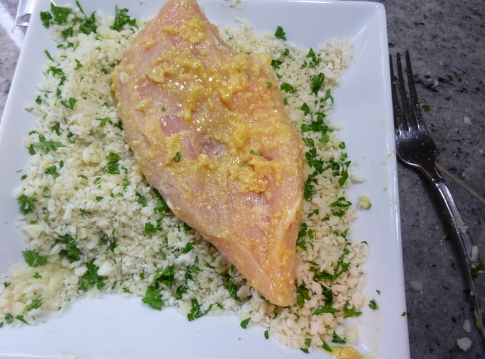 process photo showing how to coat the chicken dijon