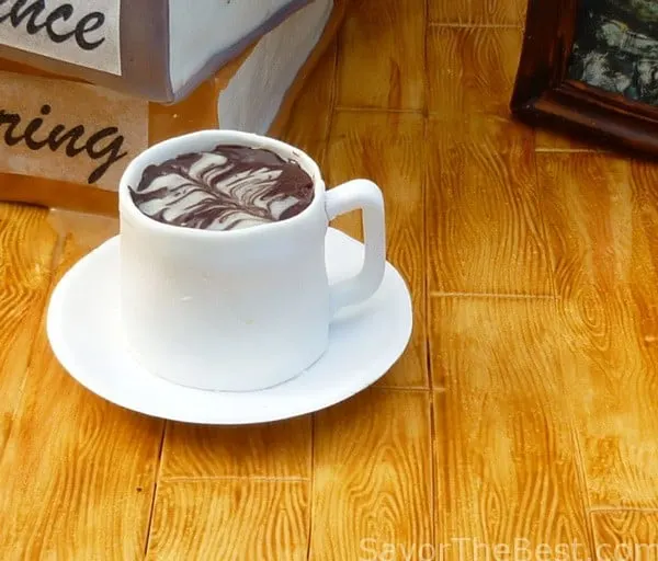 Mini tea-cup cake on desk top 