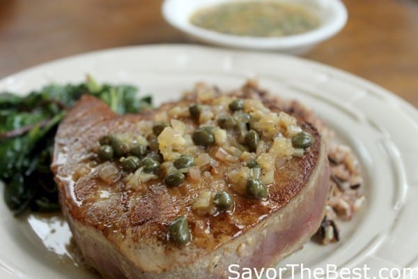 An Ahi tuna steak with lemon caper sauce. 