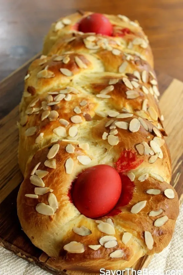 Greek Easter bread with red eggs baked into the top of the loaf. 