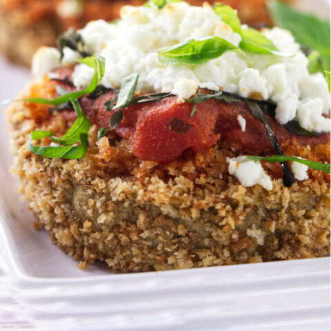 Eggplant steaks topped with goat cheese and marinara sauce.