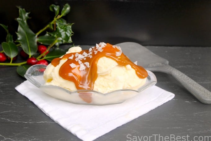 Salted Caramel Sauce on vanilla ice cream with a ice cream scoop in the background