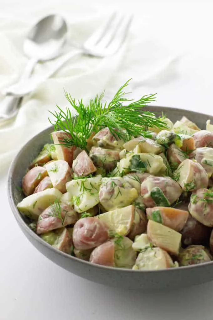 large bowl of potato salad with fresh dill