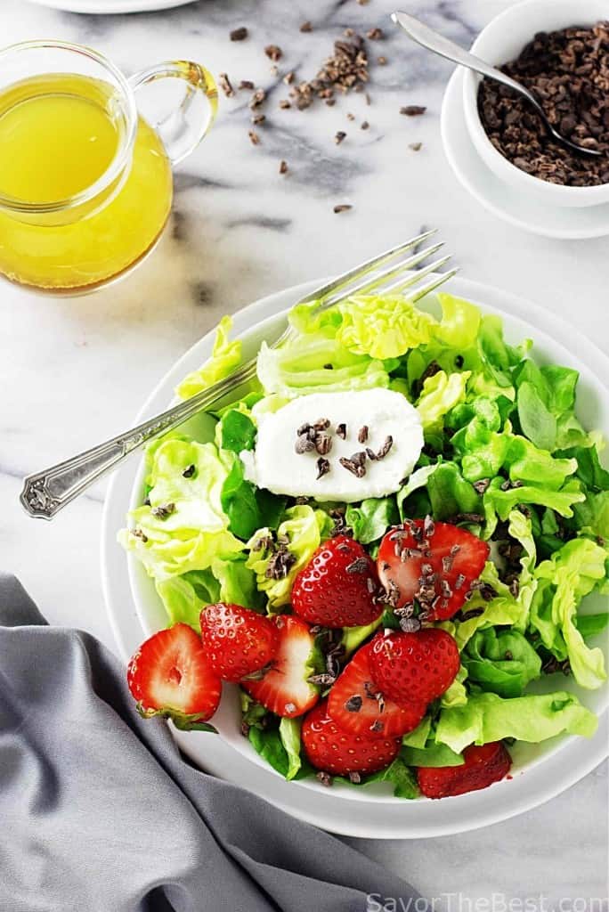 butter lettuce salad with strawberries and cocoa nibs
