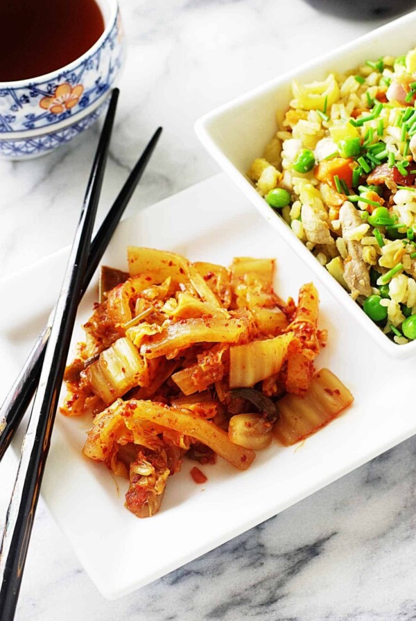 A serving of homemade kimchee on a dinner plate.