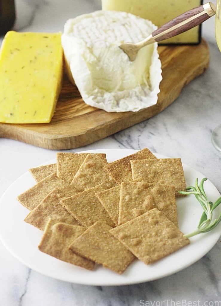 Crackers made with einkorn flour next to a cheese board. 