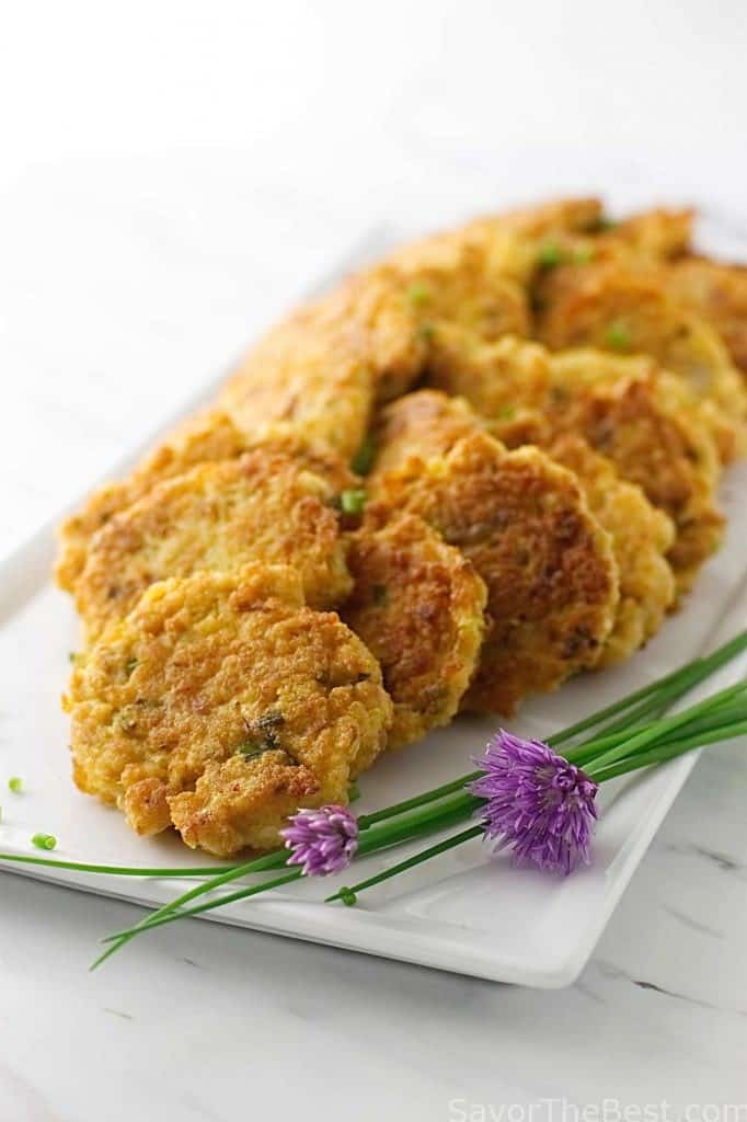 Kimchee-Pork Pancakes on a serving plate with chives. 