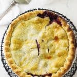 Overhead view of a pie on a wire cooling rack