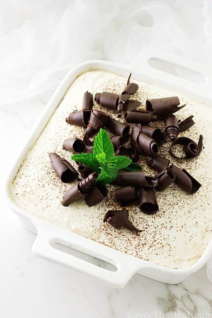 An eggless tiramisu with chocolate curls on top. 