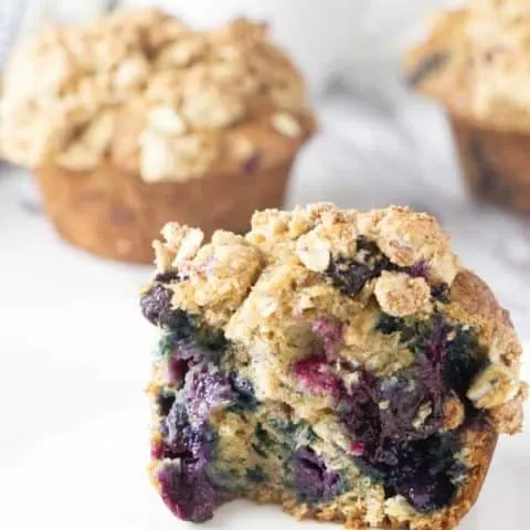 a healthy banana blueberry muffin split in half