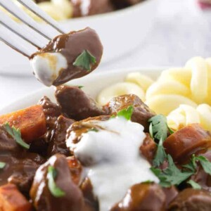 Taking a bite of a tender chunk of venison goulash