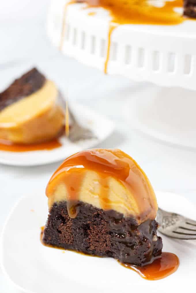 Slice of chocoflan cake covered in caramel syrup