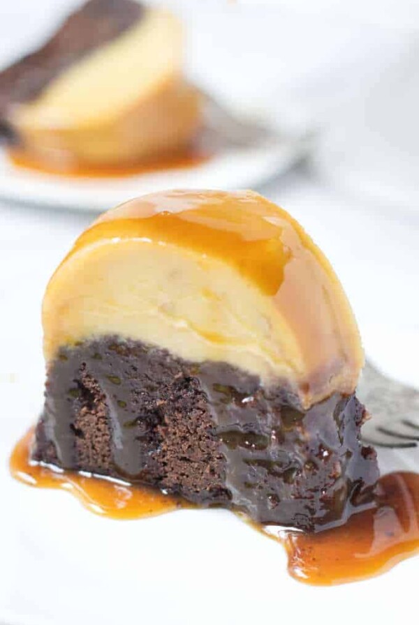 Slice of chocoflan cake covered in caramel syrup