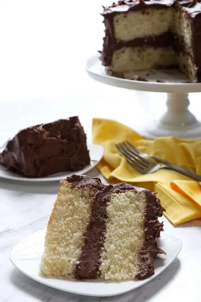 slice of yellow cake with chocolate frosting