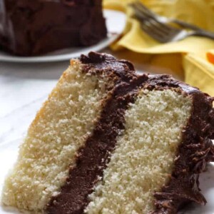 slice of yellow cake with chocolate frosting