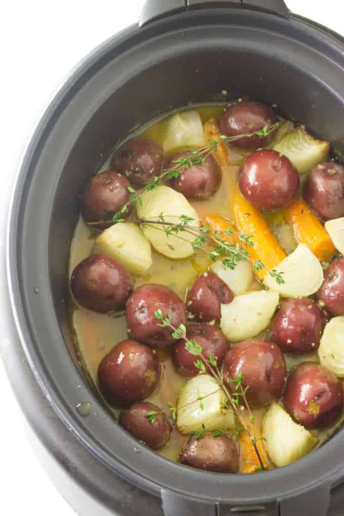 Chicken and Vegetables in a crockpot ready to cook