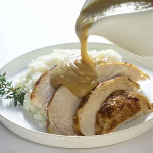 Instant pot frozen turkey breast sliced and served with gravy