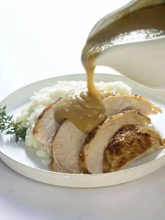 Instant pot frozen turkey breast sliced and served with gravy