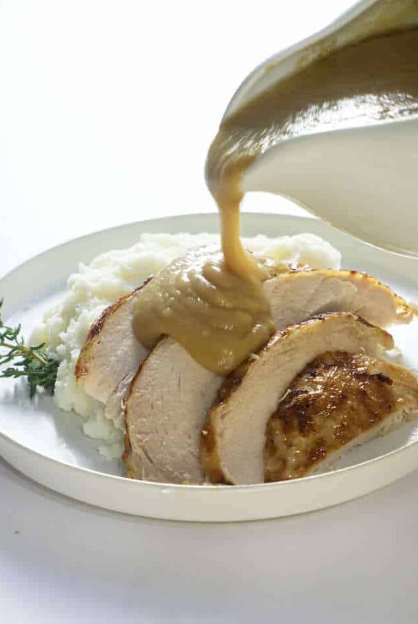 Instant pot frozen turkey breast sliced and served with gravy