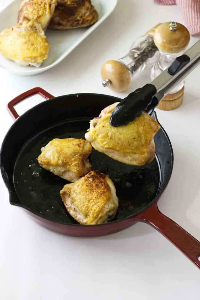 Chicken browned in a skillet