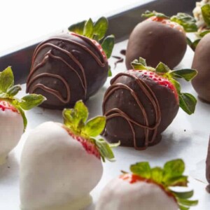 Chocolate covered strawberries on a sheet pan