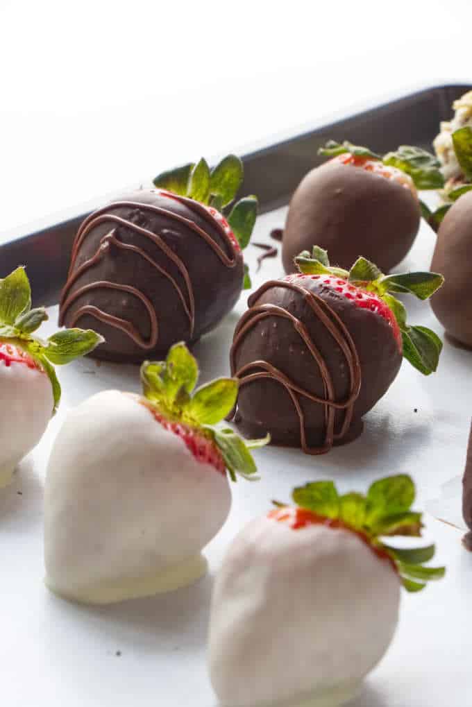 Chocolate covered strawberries on a sheet pan