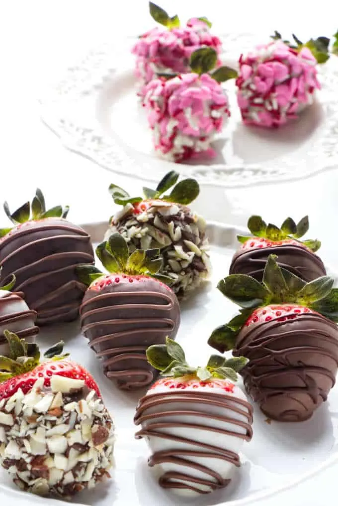chocolate covered strawberries on serving plates
