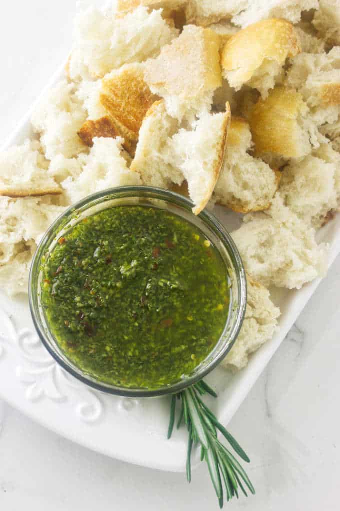 Herbed Olive Oil Dip and chunks of bread on a platter