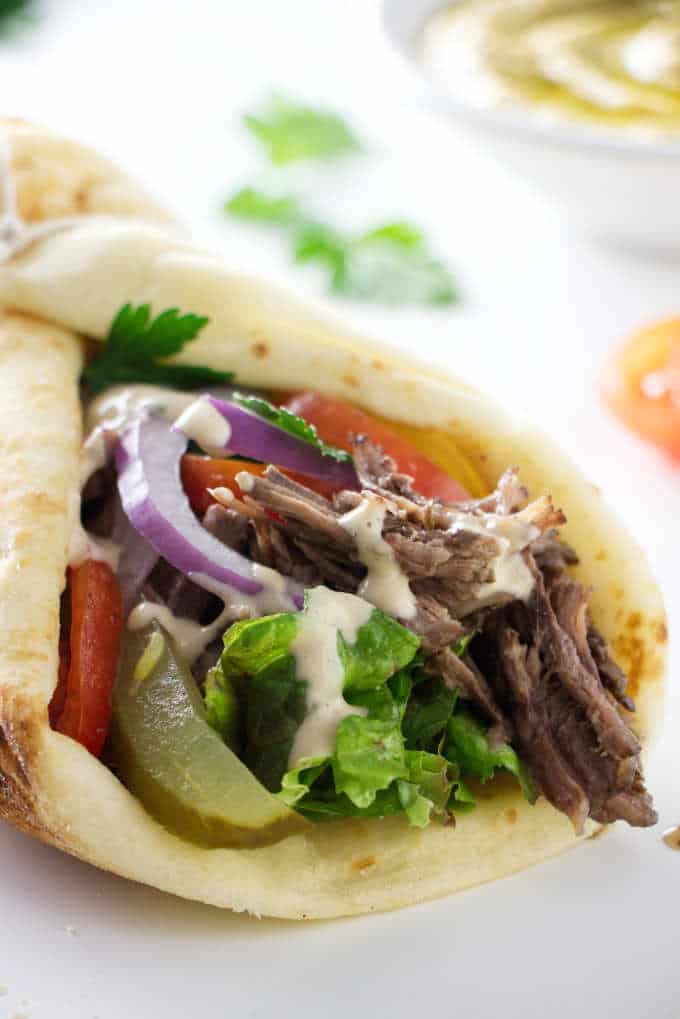 close up of a beef shawarma sandwich wrap