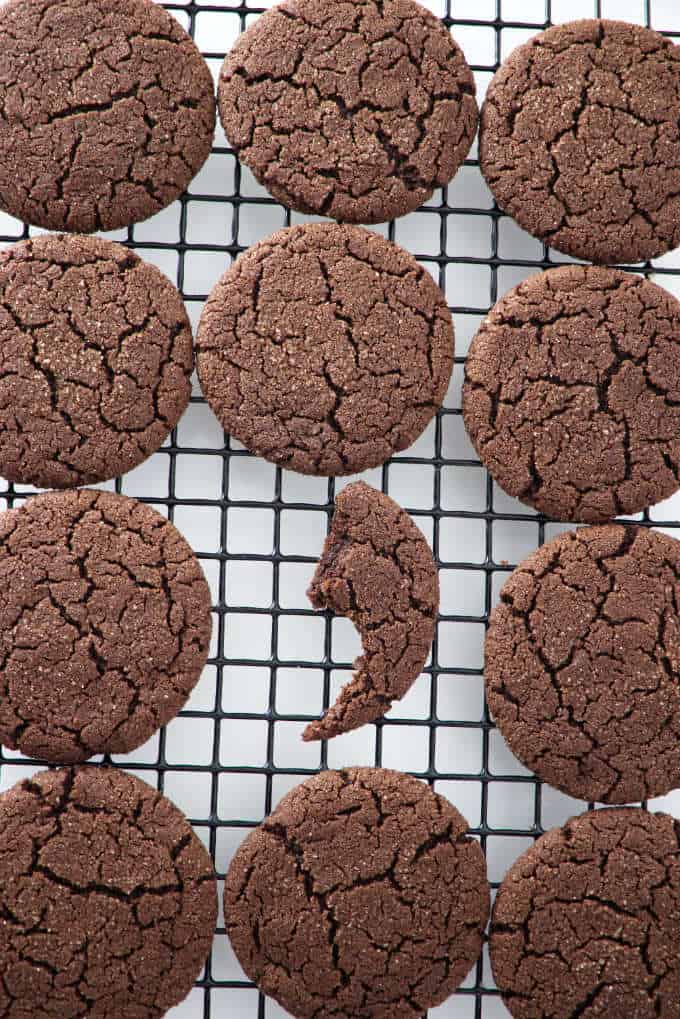 a dozen sugar cookies on a cooling rack