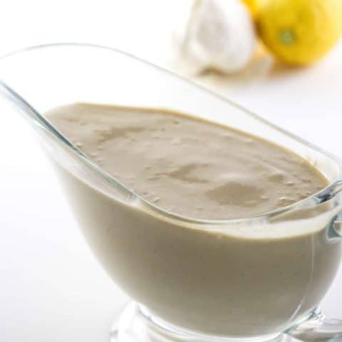 tahini dressing in a pitcher