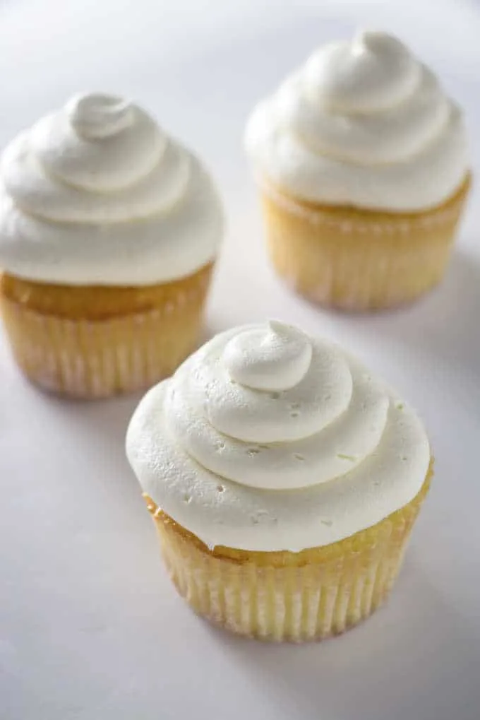 3 cupcakes with vanilla buttercream