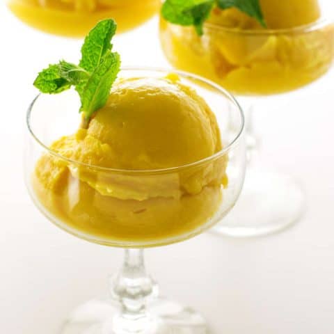 3 glasses with scoops of mango sorbet