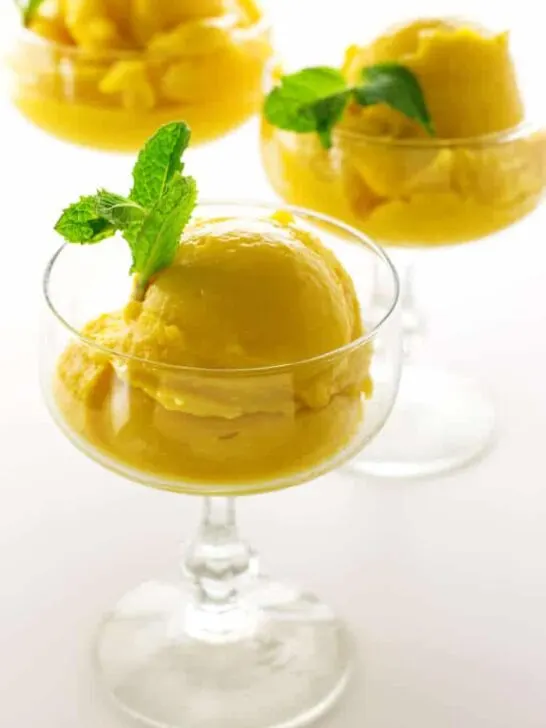 3 glasses with scoops of mango sorbet