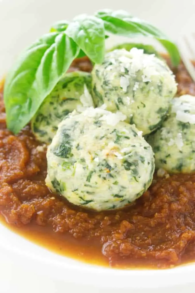 Close-up of malfatti and tomato sauce