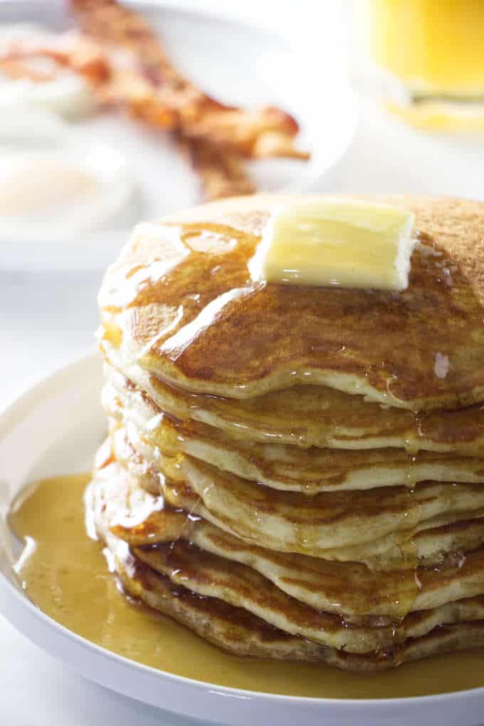 stack of sourdough pancakes with a pat of butter on top