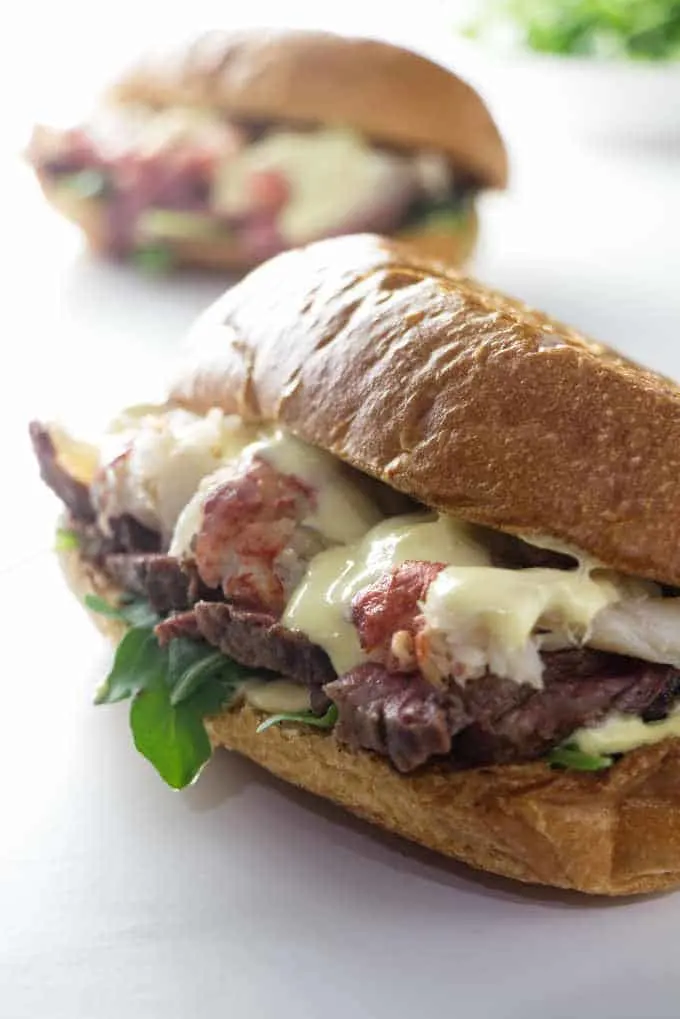 two steak and lobster sandwiches