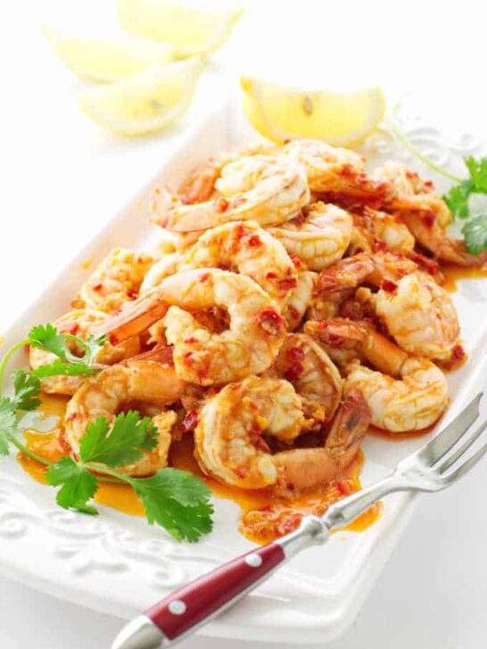 Serving plate with shrimp and lemon wedges