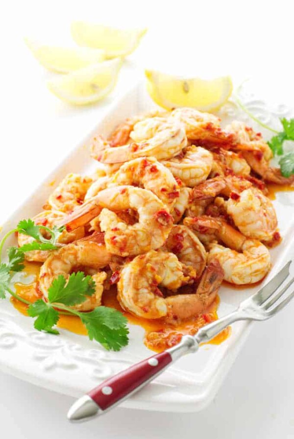 Serving plate with shrimp and lemon wedges