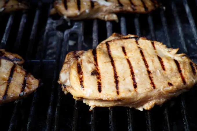 a chicken breast on a hot grill