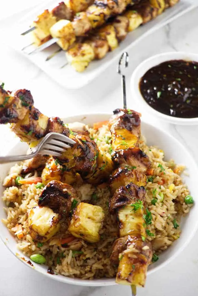 grilled pineapple chicken kabobs served with fried rice