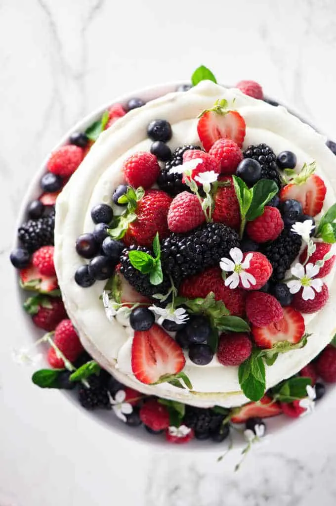 overhead photo of sponge cake with berries