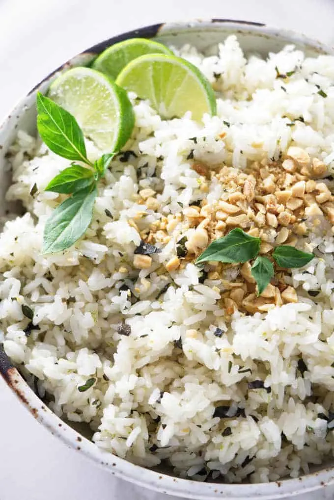 a dish of basil lime rice topped with chopped peanuts