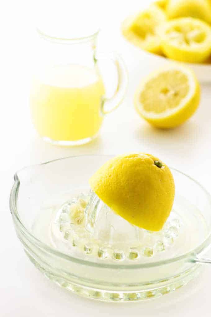 Pitcher of lemon juice and lemons