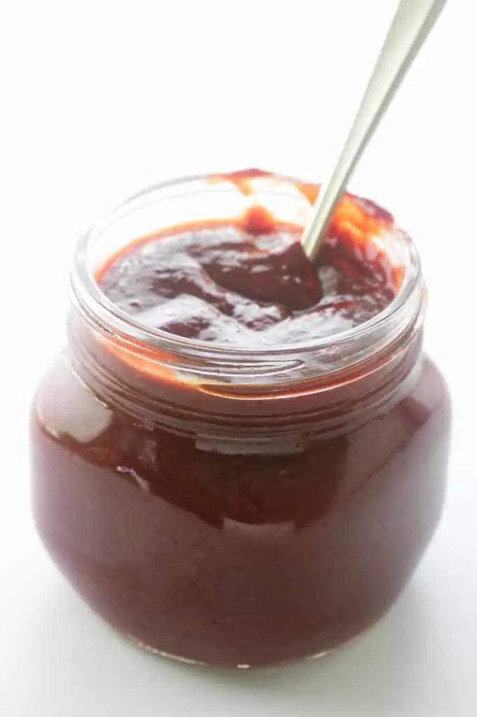 Jar of sauce with spoon
