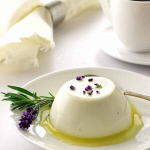 Serving of lavender panna cotta with lemon syrup