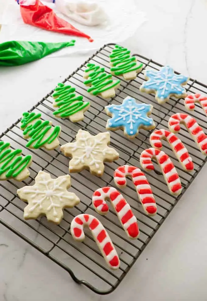 a cooling rack with decorated sugar cookies