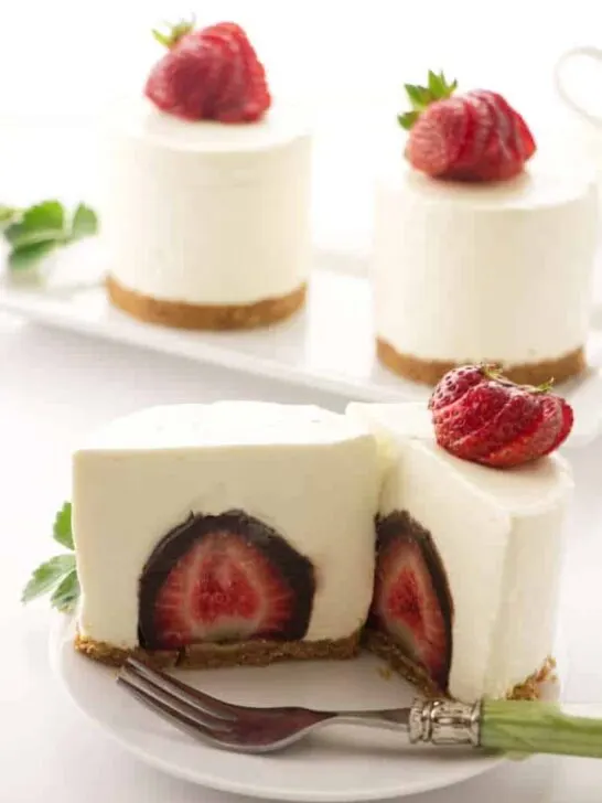 No Bake cheesecake with a chocolate covered strawberry in the center