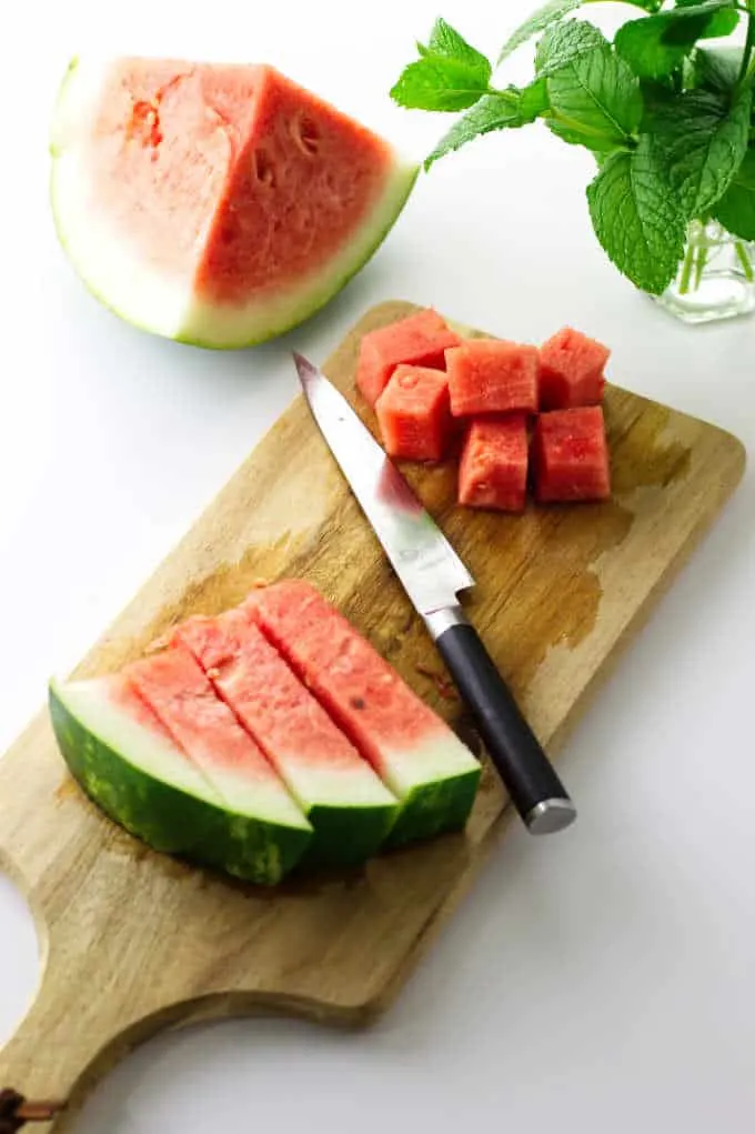 Watermelon, mint, knife and cutting board