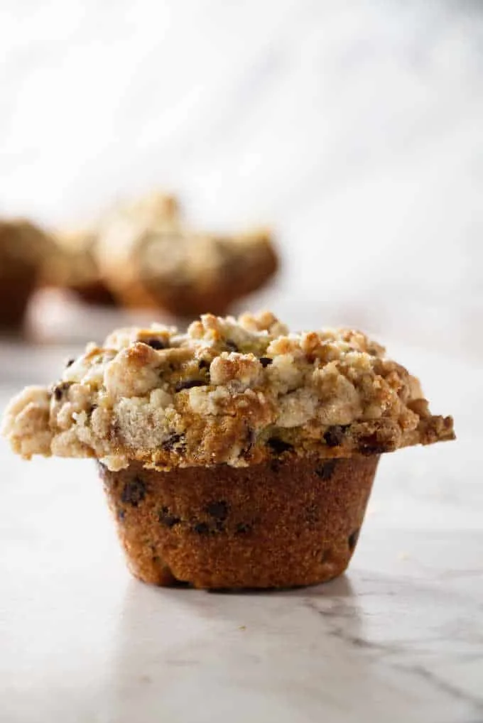 a chocolate chip muffin with streusel topping